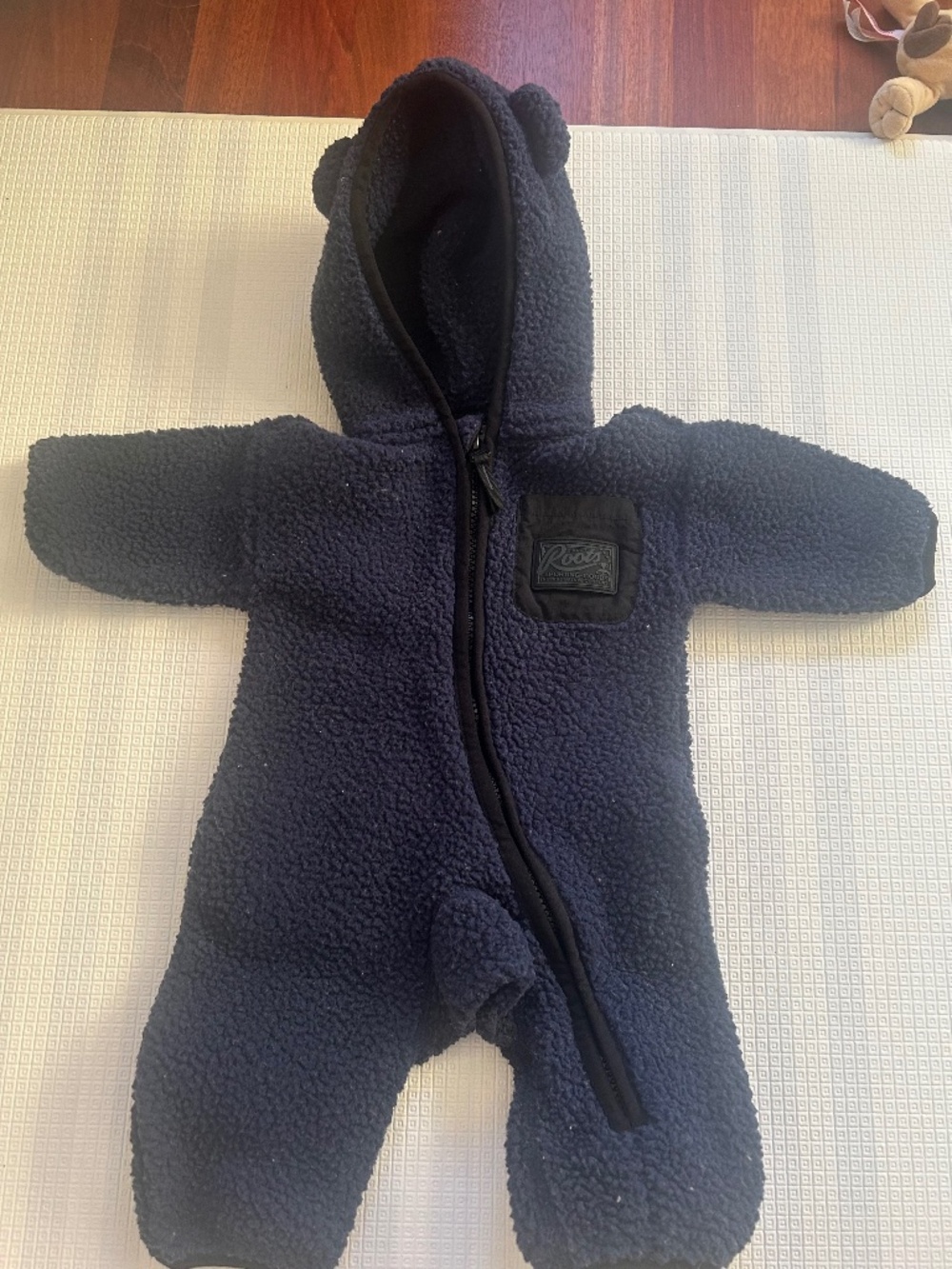 Roots baby onesie